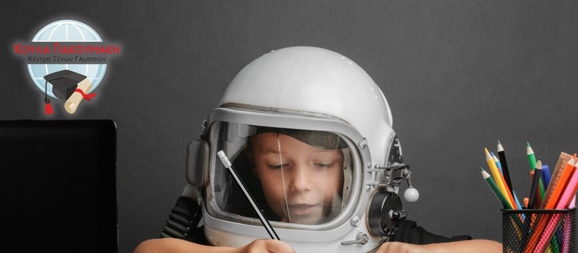 the child studies remotely at school, wearing an astronaut's helmet. back to school